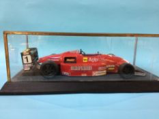 A cased model racing car, Case 59cm wide x 25.5cm deep x 18cm high (excluding plinth)