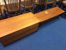 A teak blanket box and a coffee table