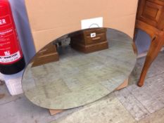 An oval mirror, with box