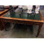 An Edwardian walnut two drawer desk, with green inset top. 153cm x 91cm