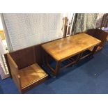 A teak nest of coffee tables and a headboard