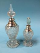 Two cut glass, silver mounted scent bottles