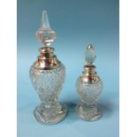 Two cut glass, silver mounted scent bottles