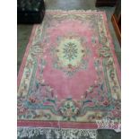 Two pink ground rugs