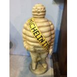 A large cast 'Michelin man' figure