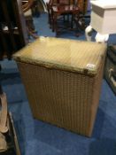 A gold Lloyd Loom linen box
