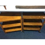 Two oak tea trolleys