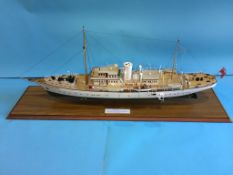 A cased display model of a boat