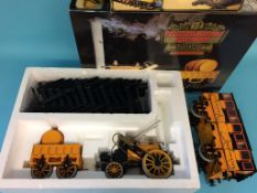 A boxed Hornby railway 'Stephenson's Rocket' and a boxed G104 coach (2)