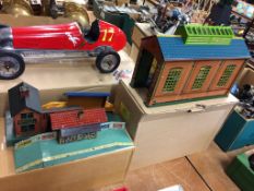A collection of tin plate model railway buildings
