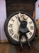 A Lifesize fibre glass figure of Harold Lloyd dangling from a clockface (clock approx. 206cm).