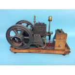 A Perkins Hopper Fed horizontal engine, stamped ' Genuine Trade Mark K-W, Made in USA', 48cm length,