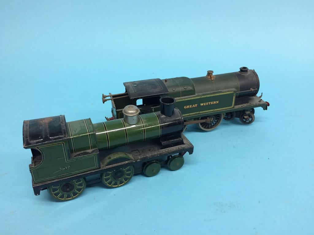A small clockwork locomotive, stamped G.B., number 3410, with green livery and a clockwork Hornby