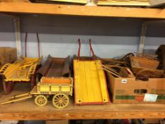 A quantity of part wooden model carts