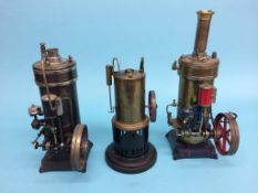 Three vertical spirit fired single cylinder model engines, two stamped G.B.N. and another (3)