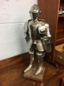 A miniature suit of armour, approx. 63cm high