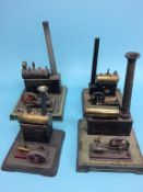 Four spirit fired single cylinder steam engines, two stamped G.B.N., one D.R.G.M. and another