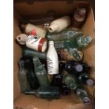 A collection of glass and stoneware beer bottles etc..