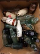 A collection of glass and stoneware beer bottles etc..