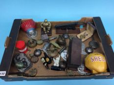 A tray of assorted collectables, including Fire Helmet, ink well, miniature machine gun, miniature