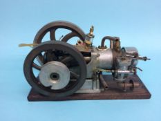 A large single cylinder petrol horizontal beam engine. 41cm width x 22cm height