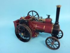 A small butane driver traction engine labelled W.M. Allchin Ltd, Northampton, 31cm width