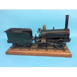 A 3 ½ inch gauge live model of an early steam locomotive, 2-2-0, with green livery