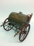 A metalwork water bowser, 'Peter Ballard and Co. Oxford'. 30cm length, 26cm width