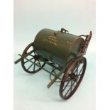 A metalwork water bowser, 'Peter Ballard and Co. Oxford'. 30cm length, 26cm width