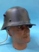 A reproduction German style helmet