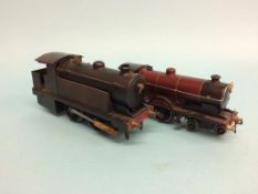 A live Bowman 'O' gauge spirit fired model locomotive, with black livery, and an 'O' gauge clockwork