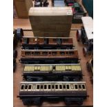 Four tin plate model railway carriages