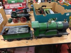 A live 2 and a half inch gauge steam model engine and tender