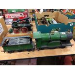 A live 2 and a half inch gauge steam model engine and tender