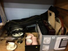 A shelf of assorted, to include golf clubs and ship in a bottle etc.