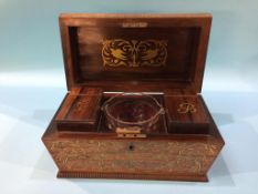 A brass inlaid tea caddy