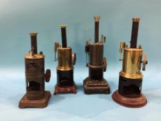 Four tin plate model vertical engines