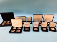 A collection of commemorative coins, some silver