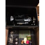 A boxed Singer electric sewing machine, no 221k1