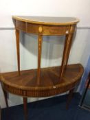 Two mahogany demi lune tables