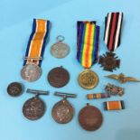 Various medals and badges etc.