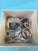 Two pairs of silver napkin rings and a pair of buckles etc.