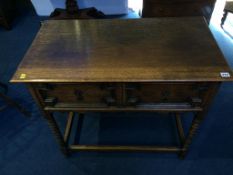 An oak two drawer hall table
