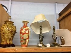 A shelf of assorted lamps