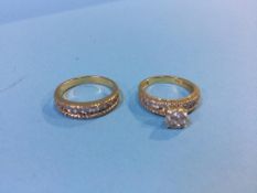 Two diamond rings, stamped '750', 8.3g