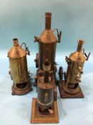 Four tin plate model vertical engines