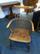 An elm seat comb back armchair