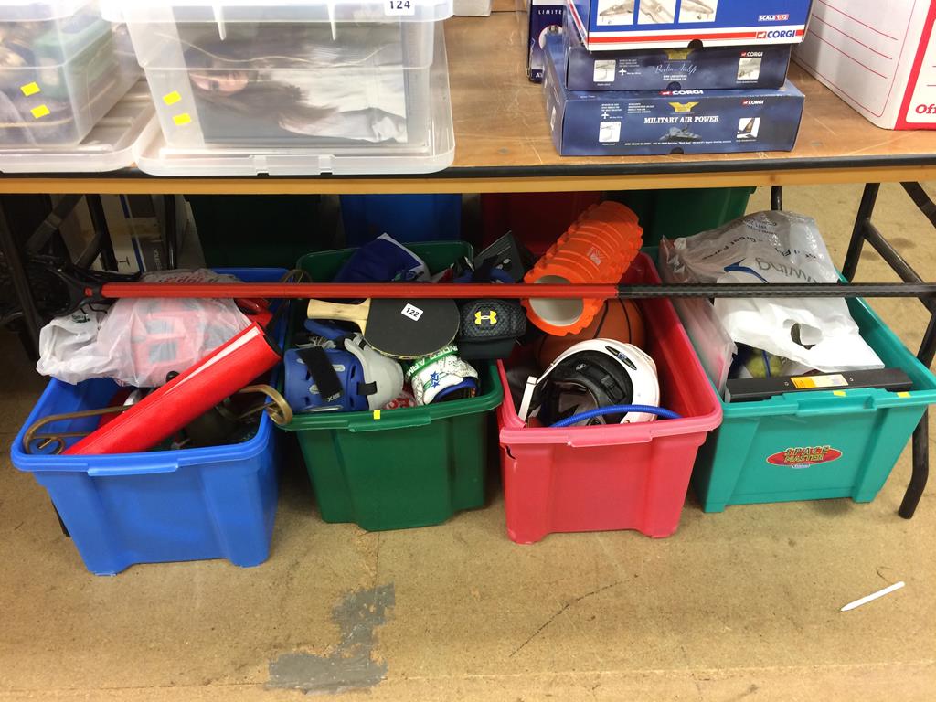 Four boxes of assorted sports equipment, to include table tennis etc.