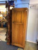 An oak single door hall wardrobe