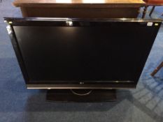 A 42" LG TV (sold as seen, with remote, no power cable)